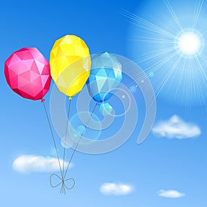 Sky, sun and low polygonal balloons