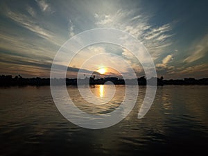 The sky when the sun will rise in the river