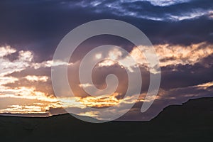 Sky during sunset with clouds and sunbeams