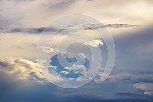 Sky before a thunderstorm with various clouds at sunset