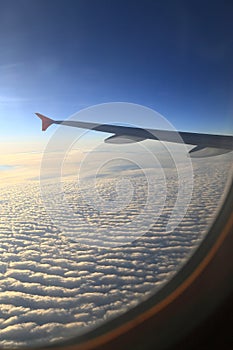 Sky view of airplanes window clouds