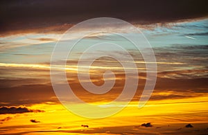 Sky with warm tone golden color background. Orange background from sunrise. Natural spring  sunrise soft color light