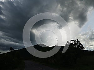 Sky with white rainy clouds in the green farmland. close up view of cloud,