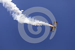 Skyaces plane performing Aerobatics with a smoke trail