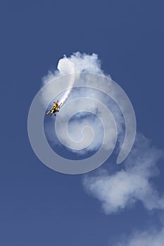 Skyaces plane performing Aerobatics with a smoke trail