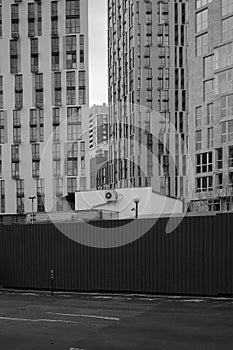 Skycraper buildings behind fence in Kyiv, Ukraine photo