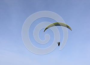 Skydiver in the blue sky. Extreme sport.