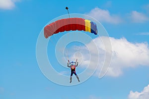 Skydiver and colorful parachute