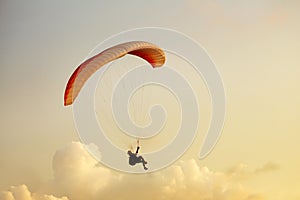 Skydiver flies on background of the cloudy sky