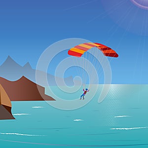 Skydiver flies over the sea and mountains. parachuting and extreme sport