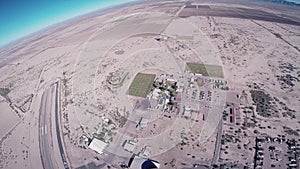 Skydiver girl parachuting above Arizona. Flight. Sunny day. Extreme sport.