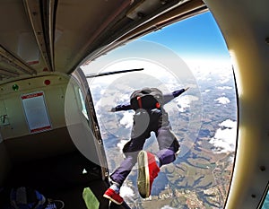 Skydiver jump out of plane photo