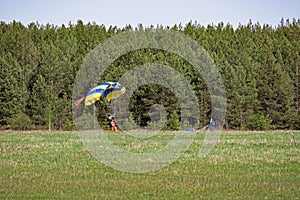 Skydiver landed in a clearing against