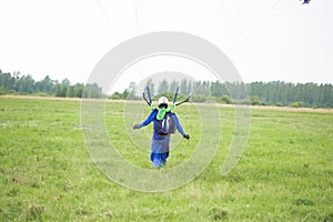 A skydiver landed on a field