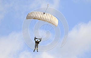 A skydiver performing skydiving with parachute