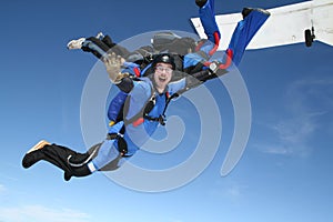 Skydiver waves at the camera photo