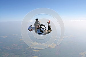 Skydiver waves at the cameraman