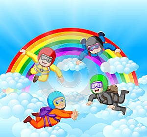 Skydivers having fun at the amazing cloud with rainbow scenery