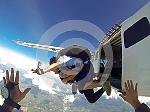 Skydivers jumping from the plane point of view