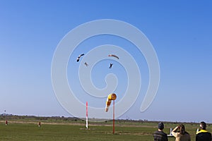 Skydivers landing on a predefined point