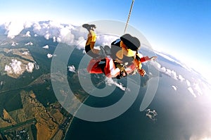 Skydivers over coast