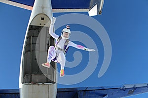 Skydiving. A beautiful girl is flying in the sky.