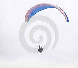 Skydiving extreme sports- parachutist with a parachute unfolded.
