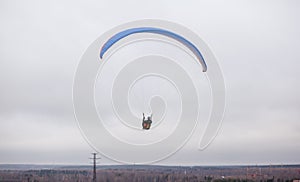Skydiving extreme sports- parachutist with a parachute unfolded.
