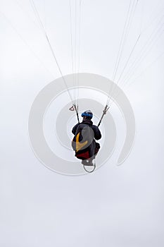 Skydiving extreme sports- parachutist with a parachute unfolded.