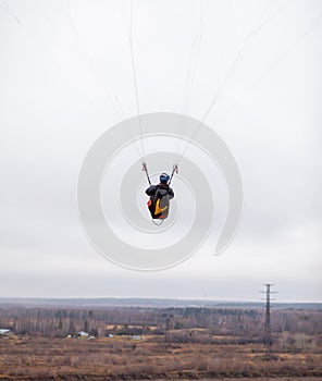 Skydiving extreme sports- parachutist with a parachute unfolded.