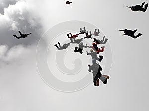 Skydiving formation above the clouds