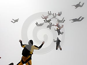 Skydiving formation inside the clouds.