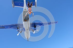 Skydiving. Girl dressed like a fox flies in the sky.