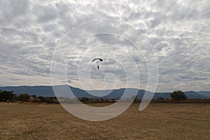 Skydiving. A parachute is landing.