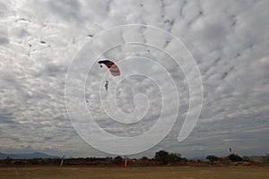 Skydiving. A parachute is landing.