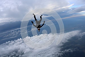 Skydiving. Skydiver is falling in head down position.