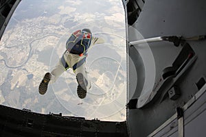 Skydiving. Skydiver has just jumped out of a plane.