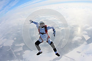 Skydiving. Skydiver is sitting above clouds.