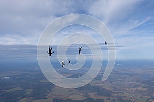 Skydiving. Skydivers are having fun in the cloudy sky.