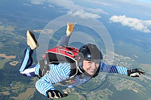 Skydiving. Solo jump. A girl is in the sky.