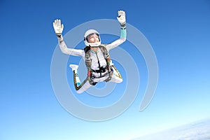 Skydiving. Solo jump. A girl is in the sky.