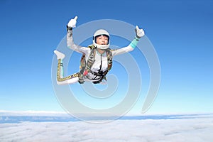 Skydiving. Solo jump. A girl is in the sky.