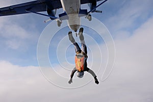 Skydiving. Solo jump. A pretty girl is in the sky.