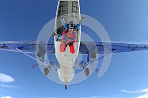 Skydiving. Tandem has jumped out of an airplane.