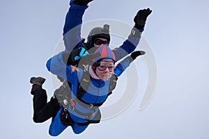 Skydiving. Tandem jump. Man and woman.