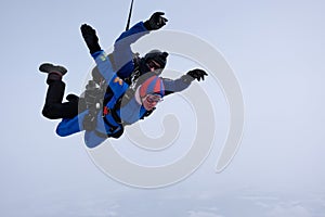 Skydiving. Tandem jump. Man and woman.