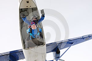Skydiving. Tandem jump. Man and woman.