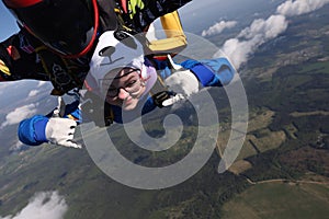 Skydiving. Tandem jump. Two people are in the sky.