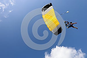 Skydiving. Tandem jump. Two people are in the sky.