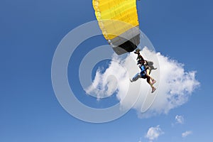 Skydiving. Tandem jump. Two people are in the sky.